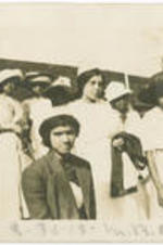 A group of women stand in a crowd at Morris Brown College. Written on recto: 3-30-12, M. B. C.