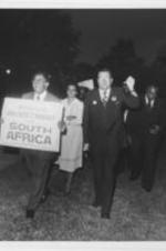 Southern Christian Leadership Conference President Joseph E. Lowery at an anti-apartheid rally with Reverend Robert Padgett (at right, next to Lowery) in Augusta, Georgia to protest the performance of a South African boys' choir at Augusta College. Written on verso: Rev. J. E. Lowery, Rev. Robert Padgett, Evangelist, Augusta, Ga.