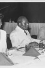 Solomon Seay, Sr. (center) sits next to an unidentified woman and Congressman William Gray at a 28th Annual SCLC Convention event.
