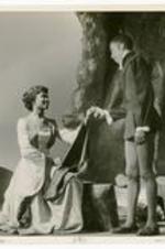 View of actors on stage. Written on verso: University Players in The Tempest, March 2, 3, 1951 (1950-1951) Rosalie Raglin, '53 as Miranda; James Johnson as Ferdinand.
