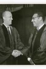 President Hugh Gloster with Samuel Protor. Written on verso: Atlanta University Center Convocation 2-2-69 Sisters Chapel L- Hugh M. Gloster president Morehouse College R- Samuel D. Proctor Dean for Special Projects University of Wisconsin.