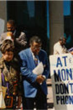 Southern Christian Leadership Conference (SCLC) President Joseph E. Lowery is shown with Evelyn G. Lowery, Fred Taylor, and others in prayer at an AT&amp;T protest.