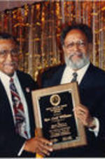 Southern Christian Leadership Conference (SCLC) President Joseph E. Lowery and Walter E. Fauntroy are shown presenting the Kelly Miller Smith Ecumenical Award to Reverend Cecil Williams at the 35th Annual SCLC Convention.