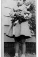 John H. Wheeler's daughter Julia holding a doll.