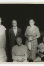 Group portrait of J. Murphy with Mrs. Yate and others.