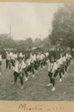 Students perform a synchronized dance and exercise outside. Written on recto: Mimetics