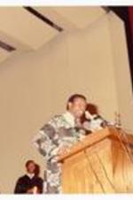Unidentified person speaking at podium.