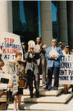 Southern Christian Leadership Conference (SCLC) President Joseph E. Lowery is shown with Evelyn G. Lowery, Fred Taylor, and others at an AT&amp;T protest.