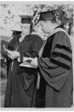 Dr. Harry Richardson stands with an unidentified professor during commencement.