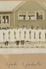 A group of girls stand outside the Chadwick school. Written on recto: Eighth grade graduates.
