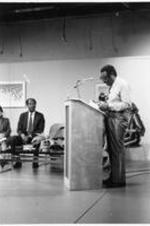 Dr. Samuel Proctor, Distinguished Professor of Education at Rutgers University, lecturing at the faculty forum as Dr. Elias Blake Jr. and others look on.