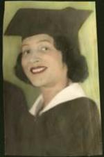 Juanita M. Eber is shown wearing a cap and gown.