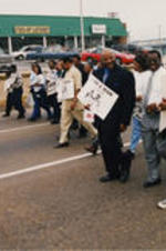 Joseph E. Lowery (at center of photo) is shown amongst a group of demonstrators with signs at a Covington Pike Toyota strike in Memphis, Tennessee.