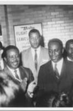 Ralph D. Abernathy is shown with Dick Hatcher, the mayor of Gary, Indiana, and others. Written on verso: Ralph; Mayor Dick Hatcher - Gary, Ind.