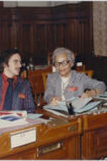Grace Townes Hamilton at her desk with Quinn Hudson at the Georgia House of Representatives.