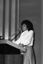 Vivian Malone Jones speaks from a podium at an event.