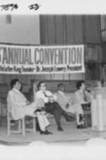 Southern Christian Leadership Conference (SCLC) President Joseph E. Lowery is shown alongside others listening to Dr. Ronald Walters speak at the 23rd Annual SCLC Convention. Written on verso: "World Community and National Survival" was the subject of Dr. Ronald Walters, Prof. Political Science Dept. Howard University, address to the delegates. Panelists (L-R) SCLC President Joseph E. Lowery, Senator James G. Abourezk, Dr. Major J. Jones, SCLC Treasurer and Randall Robinson, Director Trans-Africa.