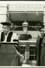 Dr. Vivian Henderson and an unidentified man at a Clark College Commencement Ceremony.