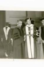 Written on verso: Parren Mitchell receives Honorary Doctorate at 1982 Commencement exercises, May 23, 1982 (L-R) Dr. Mitchell, President Gloster, Dr. Willis Hubert.