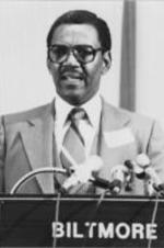 Reverend Milton Reid is shown speaking at an anti-Klan conference held in Atlanta, Georgia. The conference was sponsored by the Southern Christian Leadership Conference and the Inter-Religious Foundation for Community Organization.  Written on verso: Rev. Milton Reid lectures to conference attendees on the role the church can play in ending Klan violence and preserve the civil and human rights of all people.