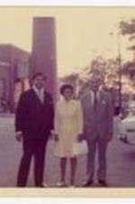President Hugh Gloster standing with Dr. Beulah Gloster and unidentified person.