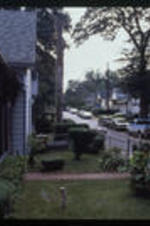 A view of a street in Reynoldstown. Text from slide presentation: The neighborhood of Reynoldstown in the late 19th century was made up of small homes and commercial buildings clustered around the railroad.