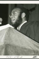 An unidentified man speaking at a Clark College Commencement Ceremony.