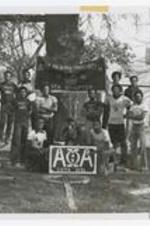 Outdoor group portrait of young men, view of banner "Alpha Phi Alpha Fraternity Inc., 1941, Iota Chapter".