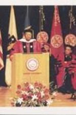 C. Eric Lincoln speaks from the podium while receiving an honorary degree from Boston University.