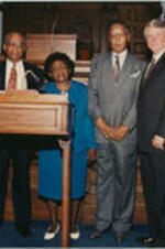 John H. Ruffin, Jr. poses for a picture with his family members and Governor Zell Miller following the swearing-in ceremony. Written on verso: Newly sworn-in Judge John H. Ruffin, Jr. Courts of Appeals of Georgia with Judith Fennell Ruffin, wife, Anna L. Davis Ruffin Gordon, mother, John H. Ruffin, Sr., father, Gov. Zell Miller, and Simeon Brinkley Ruffin, son August 24, 1994