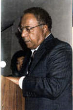 Alex Haley speaks from a podium at his house in Tennessee.