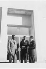 Ashley Smith (Jamaica) stands with Grady Butler (Atlanta) and another unidentified man outside the ITC administration building.