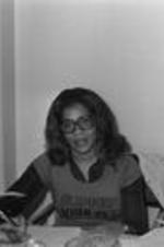 An unidentified woman sits at her desk in a VEP office.