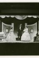 View of actors on stage. Written on verso: The Atlanta-Morehouse-Spelman Players in Fashion directed by J. Preston Cochran.