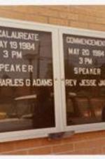 Exterior view of Baccalaureate and Commencement announcements. Written on recto Baccalaureate May 19 1984, 3pm Speaker Rev. Charles G. Adams. Commencement May 20 1984 3pm Speaker Rev. Jesse Jackson.