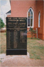 A photo of the historical marker "The Civil Rights Freedom Wall of Perry County, Alabama", presented by SCLC/W.O.M.E.N. in honor of civil rights movement leaders as part of the Civil Rights Heritage Tour.