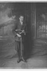 A young man, possibly John H. Wheeler, holds a violin.