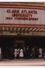Men and women stand at the entrance of the Fox Theatre; view of the marquee "Clark Atlanta University 1989 Commencement, Stars of the Bolshoi June 2."