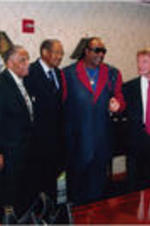 Joseph E. Lowery is shown posing for a picture with Stevie Wonder and others during his 86th birthday celebration.