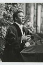 Written on verso: Clark College Commencement ca. May 1975, Left to right: 1. Rev. Epps, 2. Rev. Andrew Young(at the podium).