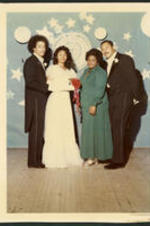 Portrait of Dwight Cedric Henderson, son of Dr. Vivian Wilson Henderson, with his prom date, Yvonne Strickland, and her parents.