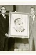 Written on verso: Ambassador from Haiti presents portrait of Dr. Martin Luther King Jr. to the College.