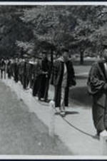 Dr. Brailsford R. Brazeal (second from right) walks with Dr. Brisbane (third from right) and others in procession at a Morehouse College commencement.
