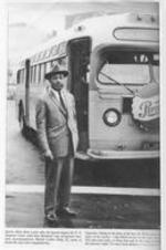A photocopy of a photograph featured in a publication showing Martin Luther King, Jr. waiting to board a bus.