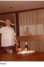 View of Dr. Kaplan at a graduation party. Written on recto: Dr. Kaplan