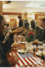 Joseph E. Lowery with other unidentified individuals at a dinner in Heidelberg, Germany. The NAACP held their 13th annual Martin Luther King, Jr. international commemoration at the University of Heidelberg.