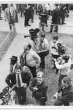 The press are shown gathered outside of a house. This photo is filed in a folder labeled "Tennessee: Memphis, LeMoyne-Owen College March, 1969 November".