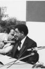 Joseph E. Lowery is shown speaking with a fellow panelist at the Meeting Per L'Amicizia Fra I Popoli, the Meeting of Friendship Among the People, in Rimini, Italy. For more details about this event, see page 43 of the September-October 1980 SCLC Magazine: http://hdl.handle.net/20.500.12322/auc.199:07014.