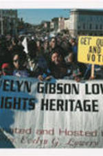 Demonstrators holding a banner that reads "The Evelyn Gibson Lowery Civil Rights Heritage Tour" march during the Selma Bridge Crossing Jubilee event