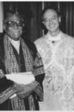 Joseph E. Lowery poses for a photo with Sam Candler, the Dean of the Cathedral of St. Philip. Written on verso: Cathedral of St. Philip. Dr. Lowery with Dean Sam Candler, Requiem for Homeless Persons - Nov. 1, 1999